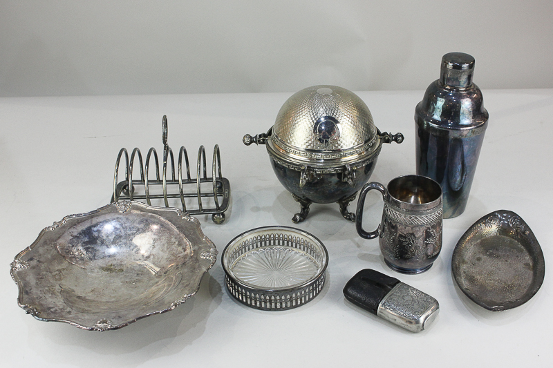 A silver plated revolving crumpet dish, a cocktail shaker, toast rack, pedestal dish, hip flask,