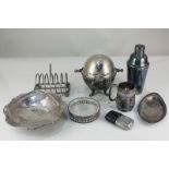 A silver plated revolving crumpet dish, a cocktail shaker, toast rack, pedestal dish, hip flask,