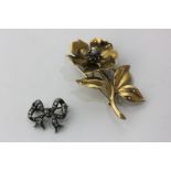 A gold, sapphire and diamond floral spray brooch, a small old cut diamond bow brooch