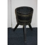 A brass bound wooden bucket on stand, 30.5cm diameter