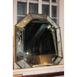 A Venetian style wall mirror with nine mirror panels and etched floral decoration, 73cm by 58cm