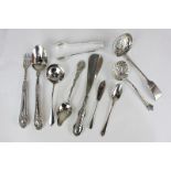 A collection of Victorian and later silver servers including two sugar sifters, sugar tongs,