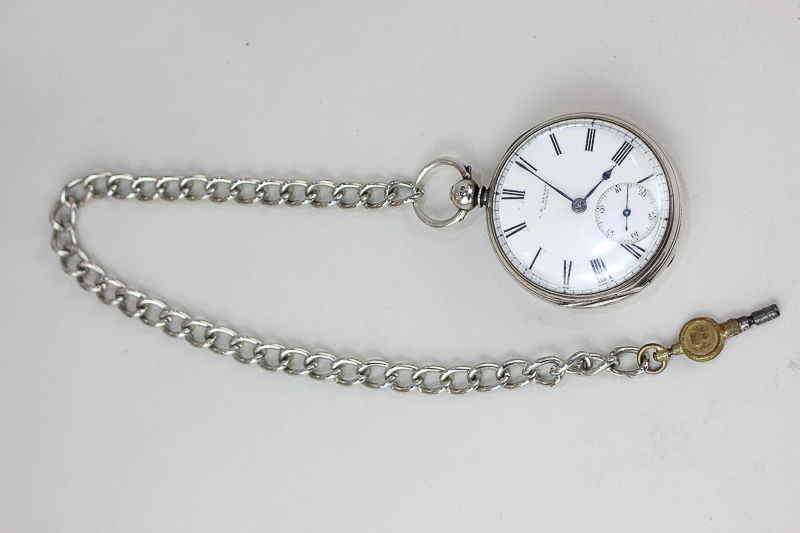 A Victorian silver pocket watch by J W Benson, with key-wind mechanism, the back engraved and signed