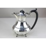 A George V silver coffee pot, oval baluster shape, on four hoof feet (lid detached), maker A J