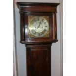 A George III oak longcase clock with 10 1/2 inch engraved square silvered dial with pierced gilt
