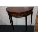 A mahogany demi-lune tea table with fold-over top, on square fluted legs, 85cm