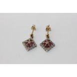 A pair of ruby and diamond drop earrings