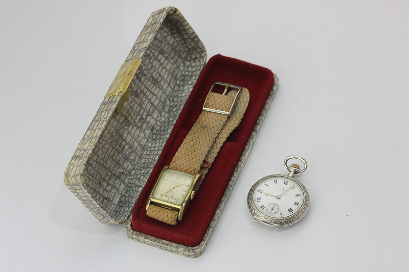 A gilt and steel wristwatch by Favre Leuba, circa 1935, a lady's silver Omega fob watch