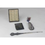 A George V silver framed desk calendar, 11cm, a cigarette case, shoe horn and silver scroll