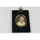 A 19th century oval miniature portrait of a lady gazing downwards, in white shawl, on ivory, 6.5cm