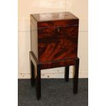 A 19th century mahogany cellarette, rectangular shape with partition for six bottles, on square