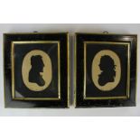 A pair of cut paper silhouette profile portraits, of a young lady and a gentleman, possibly the Duke