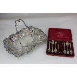 A silver plated pierced basket, rectangular form with embossed scroll border and handle, 33cm,