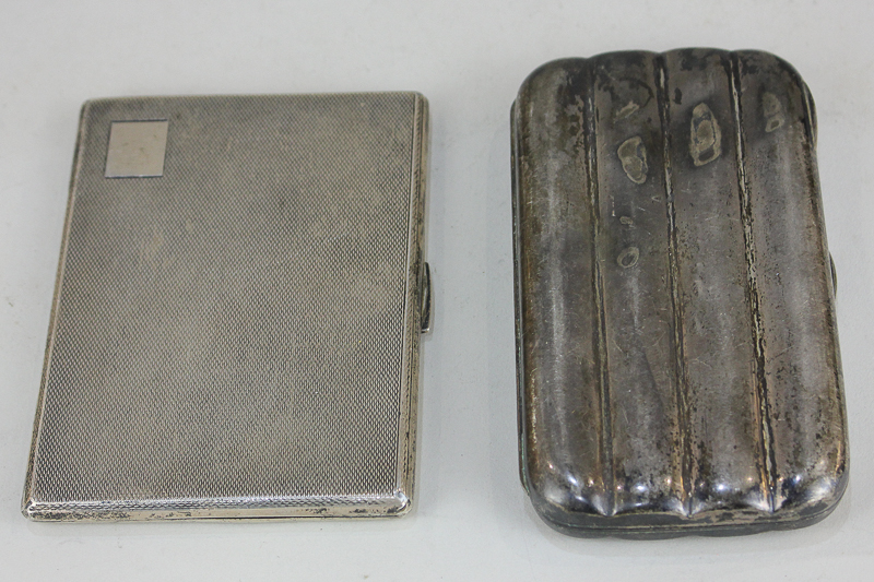 A George VI silver cigarette case, maker Frederick Field, Birmingham, 1946, together with a white