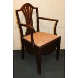 A 19th century commode chair with pierced vase splat, lift-up seat with pot and cover