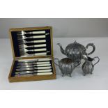 A silver plated three piece tea set of melon form with engraved floral design, together with a cased