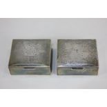 A pair of Elizabeth II silver cigarette boxes, maker Garrard & Co Ltd, London, 1962, monogrammed