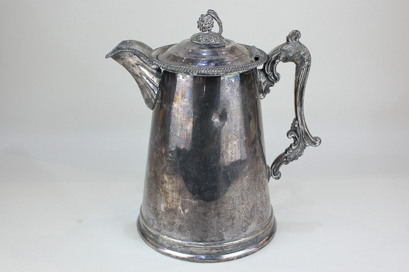 A Victorian patented silver plated flagon with cast grape and vine finial and scroll handle (a/f),