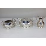 A Mappin & Webb silver plated part tea set comprising teapot of compressed circular form, and milk