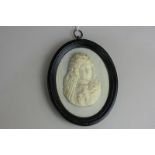 A 19th century carved ivory cameo of a gentleman, possibly Samuel Pepys, 8.5cm by 6.2cm