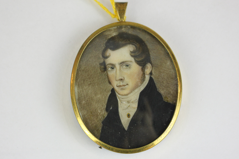 A late 18th/ early 19th century oval miniature portrait of a gentleman, in white necktie and black