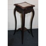 A Chinese rosewood jardiniere stand with shaped marble inlaid top, pierced and carved frieze, on