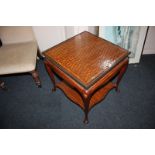 A gilt metal mounted satinwood occasional table with square inlaid trellis decorated top, on