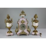 A French gilt metal mounted porcelain clock garniture, the movement stamped HP and striking on a