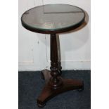 A Victorian rosewood circular occasional table, on reeded column stem and platform base, on reeded