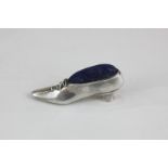 An Elizabeth II silver pin cushion in the shape of a ladies shoe, maker Ari D Norman, London, 1982