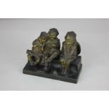 Juan Clara (Spanish 1875-1958), a bronze figure group of three children seated on a bench, signature