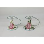 A pair of Wemyss pottery candle holders depicting pink cabbage roses, 9.5cm high, (a/f)