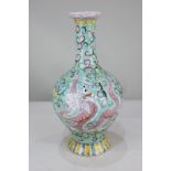A Chinese porcelain baluster vase, depicting a dragon and a Ho ho bird with floral scroll design
