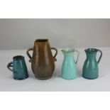 A near pair of Dicker Ware pottery jugs in shades of blue (one a/f), together with a Dicker Ware