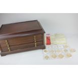 A collection of thirteen Windsor Mint gold plated commemorative coins including crowns, half