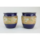 A pair of Royal Doulton Slaters pottery vases of floral and gilt design, 9.5cm diameter