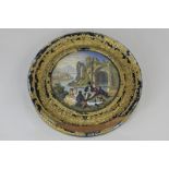 A framed 19th century paste pot lid depicting a group of picnickers in front of a ruin, 12cm