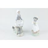 A Lladro porcelain figure of a girl and a rabbit, 23cm, and a Nao figure of a girl with a bird's