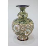 A Royal Doulton Slaters pottery baluster vase with blue and cream floral design on green and gilt