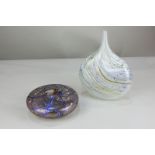 A studio lustre glass vase, circular form with trailing blue and speckled decoration, signed Karin