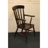 A farmhouse kitchen armchair with turned spindle back, solid elm seat, on turned legs