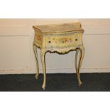 A French style yellow painted serpentine side table with floral decoration and single drawer, on