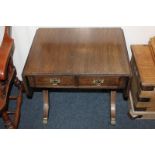 A reproduction mahogany sofa style occasional table with two drawers, on twin end supports, 59cm