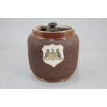 A MacIntyre pottery tobacco jar and cover, the cartouche with Leeds coat of arms, on brown ground,