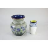 A Royal Doulton stoneware vase, tubeline decorated with blue flowers among reeds, 16.5cm, and