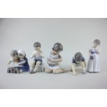A group of five Royal Copenhagen porcelain figures of children in various pursuits, tallest 14.5cm
