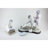 A Lladro figure group of two Japanese women, one seated on a bridge with stand (a/f - parasol