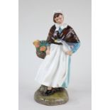 A Royal Doulton porcelain figure of a lady carrying a goose and a basket of flowers, Country Lass