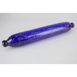 A blue glass rolling pin, hand painted with inscription 'A Sailor's Gift' flanked by a ship and