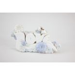 A Nao porcelain ornament of the word 'Love', mounted with two birds and flowers, 21cm